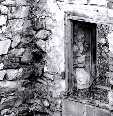 abandoned shell of stone building