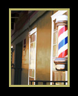 Barbershop poles are the focus of a cityscape