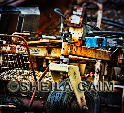 An old chair surrounded by abandoned equipment