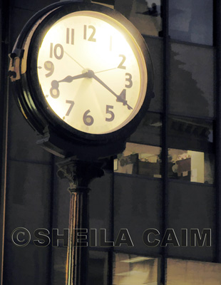 Night shot of old clock in city street