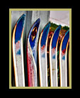 Many skis leaning against a wall thumbnail