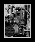 Black and white image of old oil field equipment thumbnail