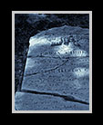 Monocolor image of broken gravestone thumbnail