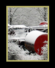 Winter scene with old oil tanks thumbnail